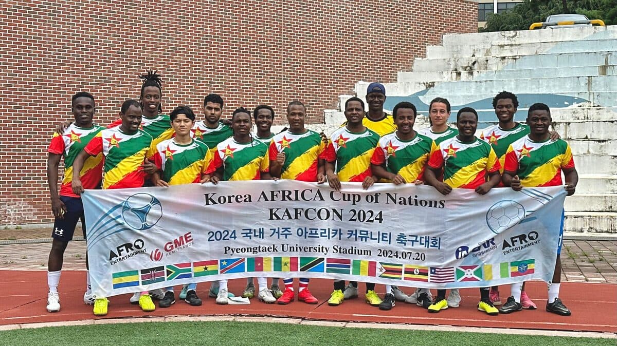Team Zimbabwe at KAFCON with banner